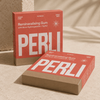 Two Perli Cinna Mint gum boxes stacked on stone surface